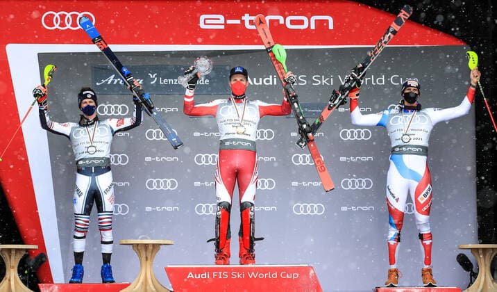 ALPINE SKIING - FIS WC Final Lenzerheide LENZERHEIDE,SWITZERLAND,21.MAR.21- ALPINE SKIING - FIS World Cup Final, slalom, men. Image shows the rejoicing of Clement Noel (FRA), Marco Schwarz (AUT) and Ramon Zenhaeusern (SUI). Keywords: medal, crystal globe. GEPAxpictures xMarioxBuehner