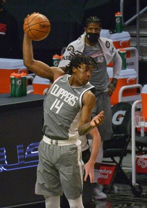 Los Angeles Clippers guard Terance Mann hauls in the offensive rebound against the Atlanta Hawks during the fourth quarter at Staples Center in Los Angeles on Monday, March 22, 2021. The Clippers defeated the Hawks 119-110 with the comeback victory.  LAP2021032209 JIMxRUYMEN