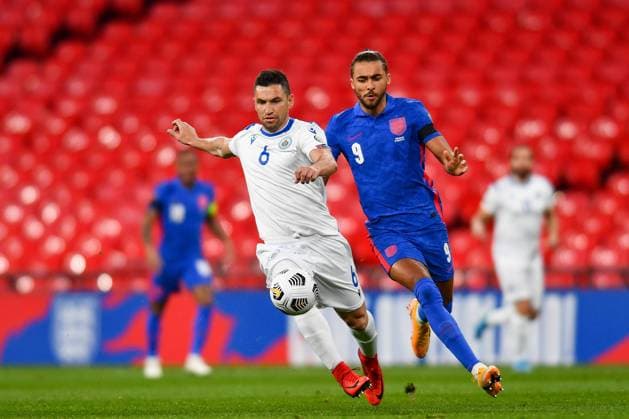 London, England, March 25th 2021: Rossi Dante Carlos (San Marino 6) and Dominic Calvert-Lewin (England 9) battle for the ball during the World Cup 2022 Qualification match between England and San Marino at Wembley Stadium in London, England. 2022 World Cup Qualifiers - England V San Marino 