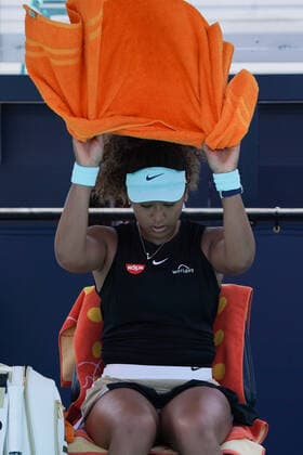MIAMI GARDENS, FL - MARCH 26: Naomi Osaka (JPN) cools down during the second round match of the Miami Open on March 26, 2021, at Hard Rock Stadium in Miami Gardens, Florida. (Photo by Michele Eve Sandberg Icon Sportswire) TENNIS: MAR 26 Miami Open Icon2103260305