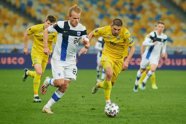 KYIV, UKRAINE - MARCH 28, 2021: 20 forward Joel Pohjanpalo vs 16 defender Vitaliy Mykolenko. The football match of Qualifying round Group D of World Cup 2022 Ukraine vs Finland Copyright: xVitaliixKliuievx