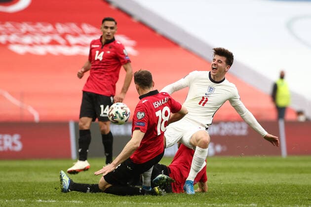 TIRANA, ALBANIA - MARCH 28: Mason Mlunt of England is fouled by Adrian Ismajli of Albania during the FIFA World Cup, WM, Weltmeisterschaft, Fussball 2022 Qatar qualifying match between Albania and England at the Qemal Stafa Stadium on March 28, 2021 in Tirana, Albania. Sporting stadiums around Europe remain under strict restrictions due to the Coronavirus Pandemic as Government social distancing laws prohibit fans inside venues resulting in games being played behind closed doors SPO, SOC, FOI 
