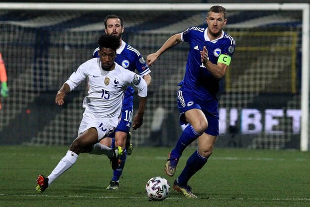 (210401) -- SARAJEVO, April 1, 2021 -- Edin Dzeko (R) of Bosnia and Herzegovina competes with Kingsley Coman (L) of France during the FIFA World Cup, WM, Weltmeisterschaft, Fussball Group D qualifying round match Between Bosnia and Herzegovina (BiH) and France in Sarajevo, BiH, on March 31, 2021. (Photo by Xinhua) (SP)BOSNIA AND HERZEGOVINA-SARAJEVO-FOOTBAL-FIFA 2022 WORLD CUP QUALIFIERS-BIH VS FRANCE NedimxGrabovica 