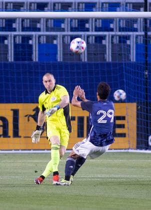 March 31, 2021, Carson, California, USA: Ethan Zubak 29 of the L.A. Galaxy tries to block a kick by goalie Matt Turner 18 of the New England Revolution during their preseason MLS, Fussball Herren, USA game on Wednesday March 31, 2021 at the Dignity Health Sports Park in Carson, California. LA Galaxy loses to Revolution, 4-1. PI Carson USA - ZUMAp124 20210331_zaa_p124_002 Copyright: xJAVIERxROJASx