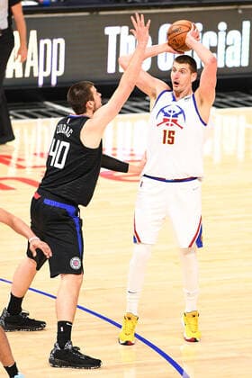 LOS ANGELES, CA - APRIL 01: Denver Nuggets Forward Nikola Jokic (15) looks to make a pass over Los Angeles Clippers Center Ivica Zubac (40) during a NBA, Basketball Herren, USA game between the Denver Nuggets and the Los Angeles Clippers on April 1, 2021 at STAPLES Center in Los Angeles, CA. The game was played without fans due to the COVID-19 pandemic. (Photo by Brian Rothmuller Icon Sportswire) NBA: APR 01 Nuggets at Clippers Icon210401031
