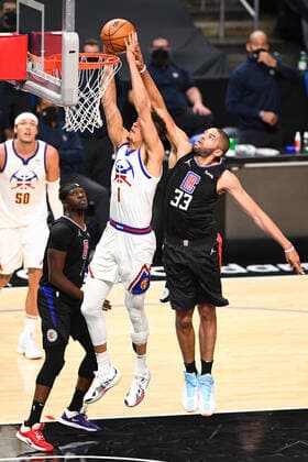 LOS ANGELES, CA - APRIL 01: Denver Nuggets Forward Michael Porter Jr. (1) goes up for a dunk as Los Angeles Clippers Forward Nicolas Batum (33) tries to defend during a NBA, Basketball Herren, USA game between the Denver Nuggets and the Los Angeles Clippers on April 1, 2021 at STAPLES Center in Los Angeles, CA. The game was played without fans due to the COVID-19 pandemic. (Photo by Brian Rothmuller Icon Sportswire) NBA: APR 01 Nuggets at Clippers Icon210401033