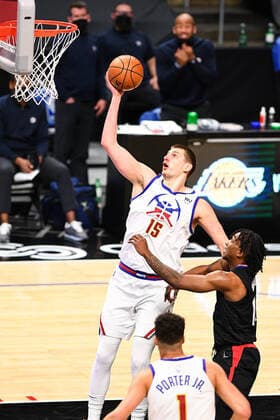 LOS ANGELES, CA - APRIL 01: Denver Nuggets Forward Nikola Jokic (15) goes up for a shot inside during a NBA, Basketball Herren, USA game between the Denver Nuggets and the Los Angeles Clippers on April 1, 2021 at STAPLES Center in Los Angeles, CA. The game was played without fans due to the COVID-19 pandemic. (Photo by Brian Rothmuller Icon Sportswire) NBA: APR 01 Nuggets at Clippers Icon210401037