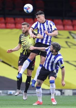 Philip Zinckernagel of Watford challenges Joey Pelupessy of Sheffield Wednesday during the Sky Bet Championship match at Vicarage Road, Watford. Picture date: 2nd April 2021. Picture credit should read: David Klein Sportimage EDITORIAL USE ONLY. No use with unauthorised audio, video, data, fixture lists, club league logos or live services. Online in-match use limited to 120 images, no video emulation. No use in betting, games or single club league player publications. SPI-0984-0014