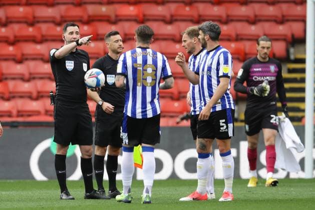 Callum Paterson of Sheffield Wednesday argues with the Referee Chris Kavangh at half time during the Sky Bet Championship match at Vicarage Road, Watford. Picture date: 2nd April 2021. Picture credit should read: David Klein Sportimage EDITORIAL USE ONLY. No use with unauthorised audio, video, data, fixture lists, club league logos or live services. Online in-match use limited to 120 images, no video emulation. No use in betting, games or single club league player publications. SPI-0984-0015