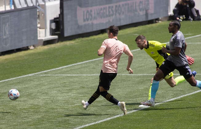 April 3, 2021, Los Angeles, California, USA: Danny Musovski 16 of the LAFC kicks a ball into goal during their preseason MLS, Fussball Herren, USA game with the New England Revolution on Saturday April 3, 2021 at the Banc of California stadium in Los Angeles, California. LAFC draws with N.E. Revolution 2-2. PI Los Angeles USA - ZUMAp124 20210403_zaa_p124_023 Copyright: xJAVIERxROJASx