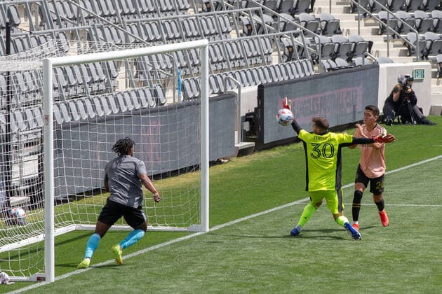 April 3, 2021, Los Angeles, California, USA: Goalie, Matt Turner 30 of the New England Revolution is unable to stop a kick by Eduard Atuesta 20 of the LAFC during their preseason MLS, Fussball Herren, USA game on Saturday April 3, 2021 at the Banc of California stadium in Los Angeles, California. LAFC draws with N.E. Revolution 2-2. PI Los Angeles USA - ZUMAp124 20210403_zaa_p124_038 Copyright: xDOUGLASxCUELLARx