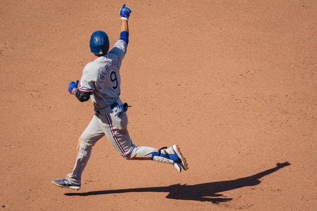 Texas Rangers third baseman Isiah Kiner-Falefa 9 points to left field after hitting a home run against the Kansas City Royals in the ninth inning at Kaufman Stadium in Kansas City, Missouri on Sunday, April 04, 2021.  KCP20210404202 KYLExRIVAS