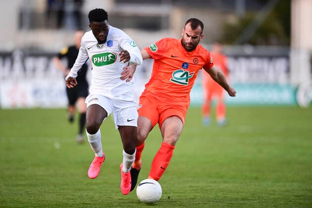 Petar Skuletic (MHSC) vs Dan Mukoko (Chateaubriant) FOOTBALL : Voltigeurs de Chateaubriant vs MHSC - 1 8 coupe de France - 07 04 2021 JBAutissier Panoramic 
