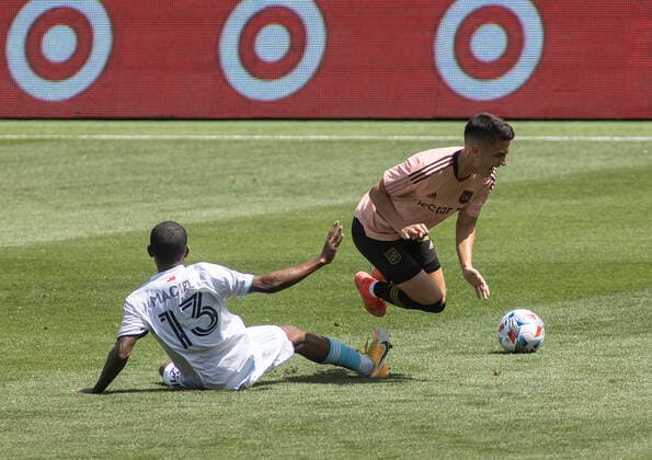 April 10, 2021, Los Angeles, California, USA: Eduard Atuesta 20 of the LAFC is fouled by Maciel 13 of the New England Revolution during their preseason MLS, Fussball Herren, USA game on Saturday April 10, 2021 at the Banc of California stadium in Los Angeles, California. LAFC draws with Revolution, 3-3. PI Los Angeles USA - ZUMAp124 20210410_zaa_p124_011 Copyright: xJAVIERxROJASx