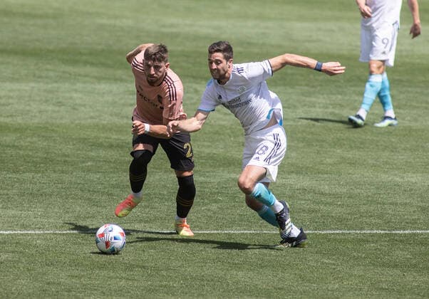 April 10, 2021, Los Angeles, California, USA: Tristan Blackmon 27 of the LAFC is defended by Matt Polster 8 of the New England Revolution during their preseason MLS, Fussball Herren, USA game on Saturday April 10, 2021 at the Banc of California stadium in Los Angeles, California. LAFC draws with Revolution, 3-3. PI Los Angeles USA - ZUMAp124 20210410_zaa_p124_012 Copyright: xJAVIERxROJASx