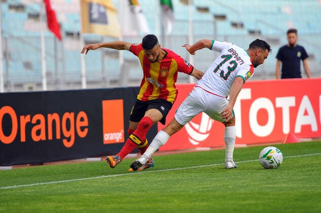 Anice Badri of EST in action with Belkacem Brahimi(13) of MCA during the Match Espérance Sportive de Tunis (EST) vs Mouloudia Club d Alger (MCA) counting for the CAF African Champions League at the Rades stadium.photo: Yassine Mahjoub CAF African Champions League: EST vs MC Algiers 