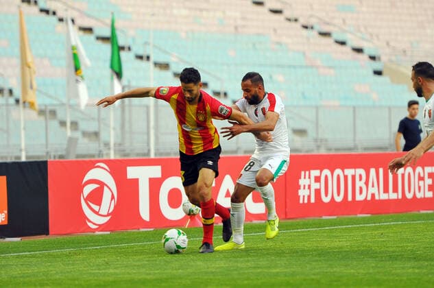 Nassim ben Khelifa(13) of EST in action with Taoufik Addadi(R) of MCA during the Match Espérance Sportive de Tunis (EST) vs Mouloudia Club d Alger (MCA) counting for the CAF African Champions League at the Rades stadium.photo: Yassine Mahjoub CAF African Champions League: EST vs MC Algiers 