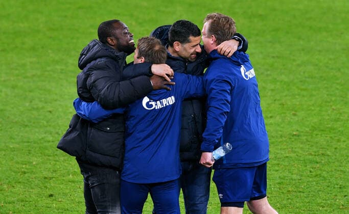 Bilder des Jahres 2021, Sport 04 April Sport Themen der Woche KW14 1. BUNDESLIGA FC SCHALKE 04 - FC AUGSBURG Schlussjubel Cheftrainer Dimitios Grammozis (S04), Teammanager Gerald Asamoah (S04) und Co-Trainer Mike Büskens (S04). Jubel, Freude, Aktion. 11.04.2021, Fussball GER, Saison 20 21, 1. Bundesliga, 28. Spieltag, FC Schalke 04 (blau) - FC Augsburg (rot) 1:0, Foto: Uwe Kraft Pool DFL regulations prohibit any use of photographs as image sequences and or quasi-video. EDITORIAL USE ONLY Gelsenkirchen NRW Deutschland *** 1 BUNDESLIGA FC SCHALKE 04 FC AUGSBURG final cheer head coach Dimitios Grammozis S04 , team manager Gerald Asamoah S04 and co-coach Mike Büskens S04 jubilation, joy, action 11 04 2021, Football GER, season 20 21, 1 Bundesliga, 28 Spieltag, FC Schalke 04 blue FC Augsburg red 1 0, Foto Uwe Kraft Pool DFL regulations prohibit any use of photographs as image sequences and or quasi video EDITORIAL USE ONLY Gelsenkirchen NRW Deutschland Poolfoto Uwe Kraft ,EDITORIAL USE ONLY