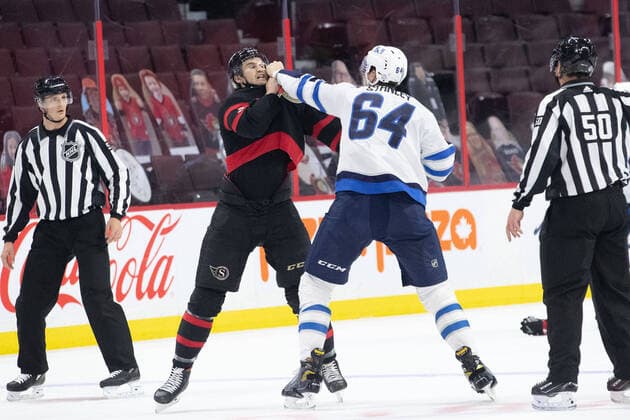Bilder des Jahres 2021, Sport 04 April Sport Themen der Woche KW15 Sport Bilder des Tages April 12, 2021: Winnipeg Jets Logan Stanley (64) and Ottawa Senators Josh Brown (3) battle in a first period fight during the NHL, Eishockey Herren, USA game between the Winnipeg Jets and the Ottawa Senators at Canadian Tire Centre in Ottawa, Canada. CSM. Ottawa Canada - ZUMAc04_ 20210412_zaf_c04_004 Copyright: xDanielxLeax