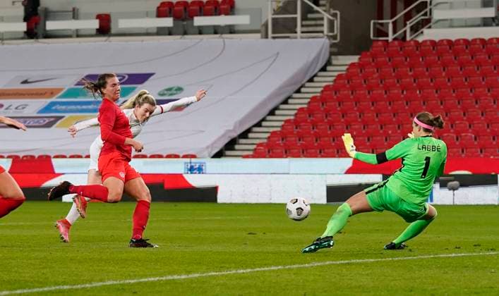 Stoke, England, 13th April 2021.Lauren Hemp of England shot is saved by Stephanie Labbe of Canada during the International Football Friendly match at The Bet365 Stadium, Stoke. Picture credit should read: Andrew Yates Sportimage EDITORIAL USE ONLY. No use with unauthorised audio, video, data, fixture lists, club league logos or live services. Online in-match use limited to 120 images, no video emulation. No use in betting, games or single club league player publications. SPI-0999-0039