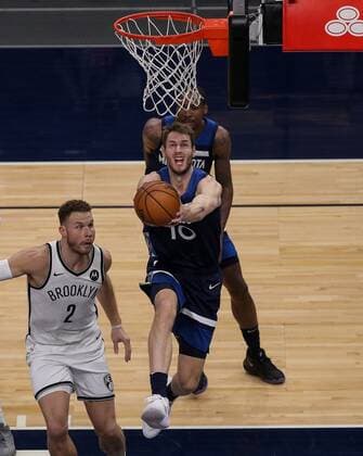 Jake Layman of the Minnesota Timberwolves tries to score against Blake Griffin (L) of the Brooklyn Nets, during an NBA, Basketball Herren, USA game at the Target Center, in Minneapolis, United States, 13 april 2021. Minnesota Timbersolves vs Brooklyn Nets !ACHTUNG: NUR REDAKTIONELLE NUTZUNG!  Copyright: xBradxRempelx AME9745 20210414-637539605509091114