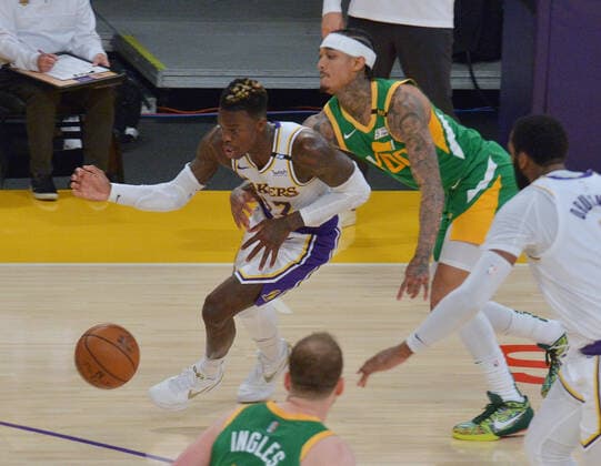 Utah Jazz guard Jordan Clarkson fouls Los Angles Lakers guard Dennis Schroder during overtime at Staples Center in Los Angeles on Saturday, April 17, 2021. The Lakers won with a 127-115 overtime defeat of the first-place Jazz.  LAP2021041702 JIMxRUYMEN