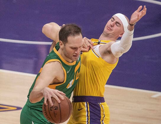 April 19, 2021, Los Angeles, California, USA: Alex Caruso 4 of the Los Angeles Lakers defends against Bojan Bogdanovic 44 of the Utah Jazz during their regular season NBA, Basketball Herren, USA game on Monday April 19, 2021 at the Staples Center in Los Angeles, California. Lakers lose to Jazz, 97-111. PI Los Angeles USA - ZUMAp124 20210419_zaa_p124_029 Copyright: xJAVIERxROJASx
