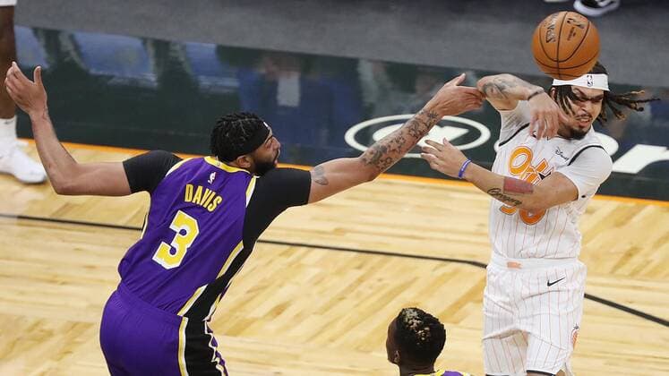 April 26, 2021: Orlando guard Cole Anthony (50) passes the ball as he is confronted by Lakers big man Anthony Davis on Monday night, April 26, 2021 at Amway Center in Orlando, Florida. - ZUMAm67_ 0116972392st Copyright: xStephenxM.xDowellx
