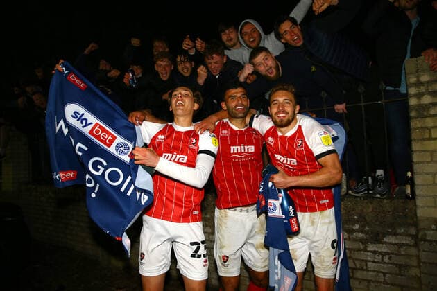 Mandatory Credit: Photo by Kieran McManus BPI Shutterstock (11877712aj) Cheltenham Town players celebrate with their fans outside the stadium after winning promotion from League Two Cheltenham Town v Carlisle United, EFL Sky Bet League Two, Football, The Jonny-Rocks Stadium, Cheltenham, UK - 27 Apr 2021 EDITORIAL USE ONLY No use with unauthorised audio, video, data, fixture lists, club league logos or live services. Online in-match use limited to 120 images, no video emulation. No use in betting, games or single club league player publications. Cheltenham Town v Carlisle United, EFL Sky Bet League Two, Football, The Jonny-Rocks Stadium, Cheltenham, UK - 27 Apr 2021 EDITORIAL USE ONLY No use with unauthorised audio, video, data, fixture lists, club league logos or live services. Online in-match use limited to 120 images, no video emulation. No use in betting, games or single club league player publications. Copyright: xKieranxMcManus BPI Shutterstockx 11877712aj