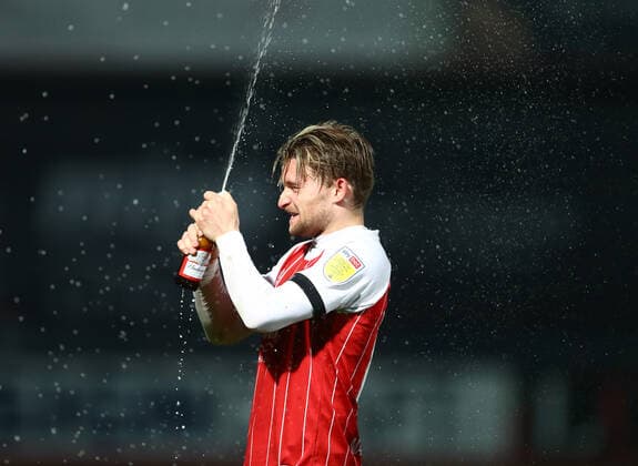 Mandatory Credit: Photo by Kieran McManus BPI Shutterstock (11877712au) Alfie May of Cheltenham Town celebrates promotion from League One by spraying beer Cheltenham Town v Carlisle United, EFL Sky Bet League Two, Football, The Jonny-Rocks Stadium, Cheltenham, UK - 27 Apr 2021 EDITORIAL USE ONLY No use with unauthorised audio, video, data, fixture lists, club league logos or live services. Online in-match use limited to 120 images, no video emulation. No use in betting, games or single club league player publications. Cheltenham Town v Carlisle United, EFL Sky Bet League Two, Football, The Jonny-Rocks Stadium, Cheltenham, UK - 27 Apr 2021 EDITORIAL USE ONLY No use with unauthorised audio, video, data, fixture lists, club league logos or live services. Online in-match use limited to 120 images, no video emulation. No use in betting, games or single club league player publications. Copyright: xKieranxMcManus BPI Shutterstockx 11877712au