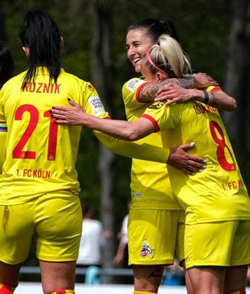 Cologne, Germany, April 28th 202 Mandy Islacker (8 FcK?ln) celebrating her teams third goal with Francesca Calo (2 FcK?ln)and Peggy Kuznik (21 FcK?ln) during the 2. Frauen Bundesliga game between 1. Fc Koeln and Fc Bayern Muenchen II at the Franz-Kremer Stadion in Cologne, Germany. 2. Frauen Bundesliga - 1. Fc Koeln v Fc Bayern Muenchen II 
