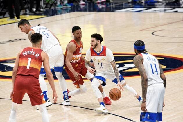 Sport Bilder des Tages New Orleans Pelicans guard Lonzo Ball 2 (R) drives past Denver Nuggets guard PJ Dozier 35 (CR), as New Orleans Pelicans center Willy Hernangomez 9 (CL) and Denver Nuggets forward Michael Porter Jr. 1 (L) and New Orleans Pelicans forward Brandon Ingram 14 (far R) look on during a NBA, Basketball Herren, USA game at the Ball Arena in Denver, CO, USA, 28 April 2021. New Orleans Pelicans at Denver Nuggets !ACHTUNG: NUR REDAKTIONELLE NUTZUNG!  Copyright: xToddxPiersonx AME3585 20210429-637552751913974410