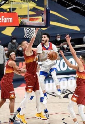 New Orleans Pelicans guard Lonzo Ball 2 (CR) goes in for a basket against Denver Nuggets center Nikola Jokic 15 (CL) as Denver Nuggets forward Aaron Gordon 50 (L) and Denver Nuggets forward Michael Porter Jr. 1 (R) look on during a NBA, Basketball Herren, USA game at the Ball Arena in Denver, CO, USA, 28 April 2021. New Orleans Pelicans at Denver Nuggets !ACHTUNG: NUR REDAKTIONELLE NUTZUNG!  Copyright: xToddxPiersonx AME3584 20210429-637552751932751266