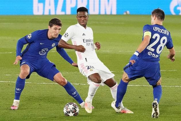 Real Madrid s Vinicius Junior (c) and Chelsea FC s Andreas Christensen (l) and Cesar Azpilicueta during UEFA Champions League Semi-finals 1st leg match. April 27,2021. (2021042787)