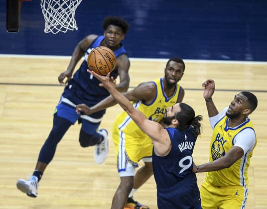 April 29, 2021, Minneapolis, Minnesota, USA: Minnesota Timberwolves guard Ricky Rubio (9) scores a layup as he is defended by Golden State Warriors center Kevon Looney (5) and forward Andrew Wiggins (22) in the first half on Thursday, April 29, 2021 at Target Center in Minneapolis, Minnesota. Minneapolis USA - ZUMAm67_ 0117019936st Copyright: xAaronxLavinskyx