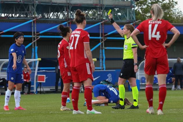 London, England, May 2nd 2021: Lina Magull ( 16 Bayern Munich) sees yellow card for her faul on Fran Kirby ( 14 Chelsea) that led to Chelsea 2nd goal during the UEFA Womens Champions League Semi Final game between Chelsea and Bayern Munich at Kingsmeadow in London, England. UEFA Womens Champions League Semi Final - Chelsea v Bayern Munic 