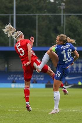 London, England, May 2nd 2021: Magdalena Eriksson ( 16 Chelsea) accidentally catches Hanna Glas ( 5 Bayern Munich) during the UEFA Womens Champions League Semi Final game between Chelsea and Bayern Munich at Kingsmeadow in London, England. UEFA Womens Champions League Semi Final - Chelsea v Bayern Munic 