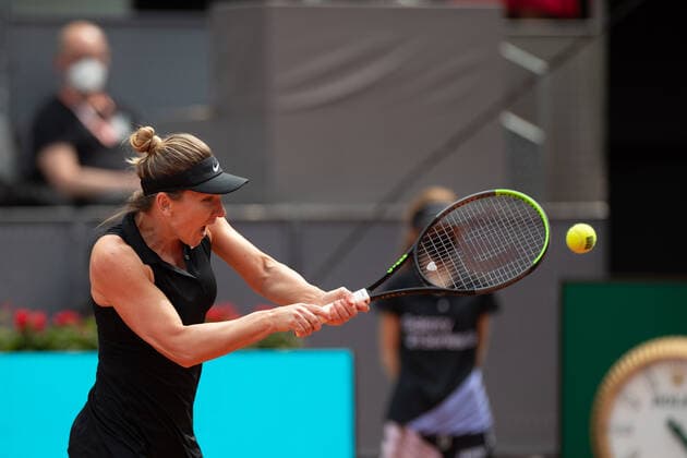 (210503) -- MADRID, May 3, 2021 -- Simona Halep of Romania returns the ball during the women s singles 2nd round match against Zheng Saisai of China at the Madrid Open tennis tournament in Madrid, Spain, May 2, 2021. ) (SP)SPAIN-MADRID-TENNIS-MADRID OPEN MengxDingbo 