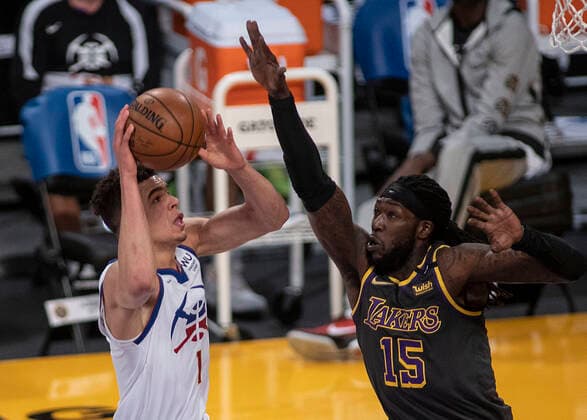 May 3, 2021, Los Angeles, California, USA: Montrezl Harrell 15 of the Los Angeles Lakers tries to block a shot by Michael Porter, Jr. 1 of the Denver Nuggets during their regular season NBA, Basketball Herren, USA game on Monday May 3, 2021 at the Staples Center in Los Angeles, California. Lakers defeat Nuggets, 93-89. PI Los Angeles USA - ZUMAp124 20210503_zaa_p124_009 Copyright: xJAVIERxROJASx