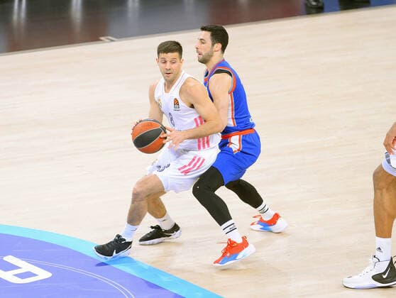 Dogus Balbay (R) of Anadolu Efes and Nicolas Laprovittola of Real Madrid during the Turkish Airlines Euroleague quarter final 5th match between Anadolu Efes and Real Madrid at Sinan Erdem Dome in Istanbul , Turkey on May 04 , 2021. 