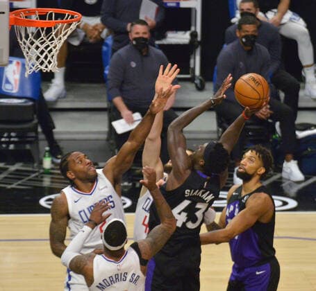 Toronto Raptors forward Pascal Siakam (43) scores on Los Angeles Clippers forwards Kawhi Leonard (2) and Marcus Morris Sr. (8) during the second half at Staples Center in Los Angeles on Tuesday, May 4, 2021. The Clippers defeated the Raptors 105-100 to end a three-game losing streak.  LAP2021050402 JIMxRUYMEN
