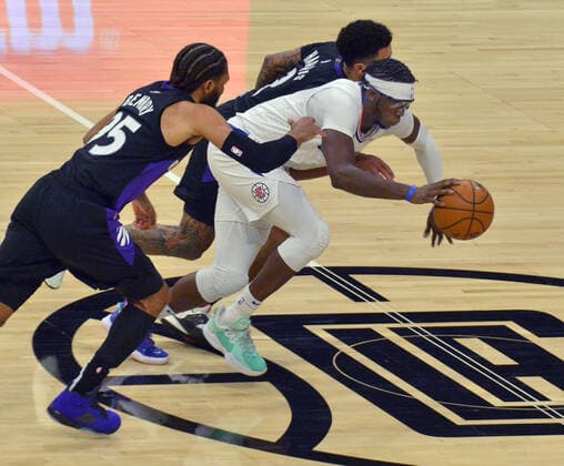 Los Angeles Clippers guard Regggie Jackson (1) steals the ball from Toronto Raptors guard Jalen Harris (2) to score on a fast break during the second half at Staples Center in Los Angeles on Tuesday, May 4, 2021. The Clippers defeated the Raptors 105-100 to end a three-game losing streak.  LAP2021050411 JIMxRUYMEN