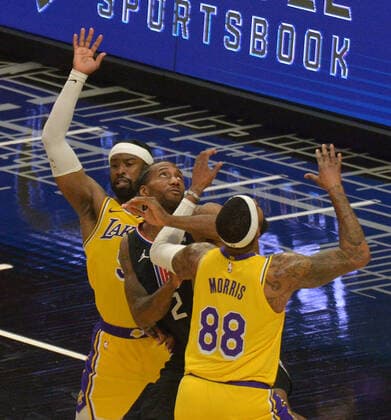 Los Angeles Clippers forward Kawhi Leonard is double-teamed by Los Angeles Lakers guard Wesley Matthews (9) and forward Markieff Morris (88) during the second half at Staples Center in Los Angeles on Thursday May 6, 2021. The Clippers defeated the Lakers 118-94.  LAP2021050616 JIMxRUYMEN