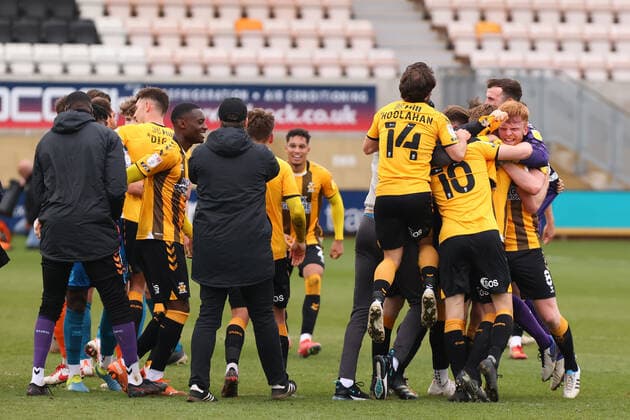 8th May 2021; Abbey Stadium, Cambridge, Cambridgeshire, England; English Football League Two Football, Cambridge United versus Grimsby Town; Cambridge Utd players celebrate as they are promoted to EFL league 1  ActionPlus12286848 ShaunxBrooks