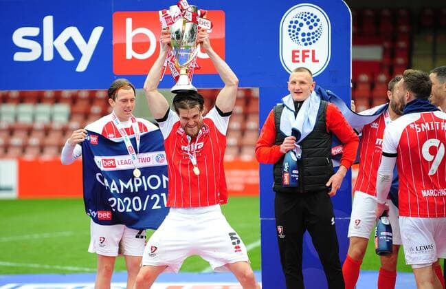 Mandatory Credit: Photo by Nizaam Jones JMP Shutterstock (11894506an) Cheltenham Town celebrate winning the league- Mandatory by-line: Nizaam Jones JMP Cheltenham Town v Harrogate Town, UK - 08 May 2021 EDITORIAL USE ONLY No use with unauthorised audio, video, data, fixture lists (outside the EU), club league logos or live services. Online in-match use limited to 45 images (+15 in extra time). No use to emulate moving images. No use in betting, games or single club league player publications services. Cheltenham Town v Harrogate Town, UK - 08 May 2021 EDITORIAL USE ONLY No use with unauthorised audio, video, data, fixture lists (outside the EU), club league logos or live services. Online in-match use limited to 45 images (+15 in extra time). No use to emulate moving images. No use in betting, games or Copyright: xNizaamxJones JMP Shutterstockx 11894506an