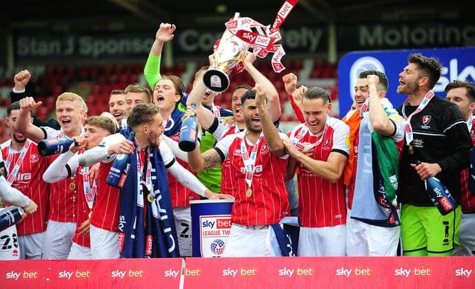 Mandatory Credit: Photo by Nizaam Jones JMP Shutterstock (11894506au) Cheltenham Town celebrate winning the league Cheltenham Town v Harrogate Town, UK - 08 May 2021 EDITORIAL USE ONLY No use with unauthorised audio, video, data, fixture lists (outside the EU), club league logos or live services. Online in-match use limited to 45 images (+15 in extra time). No use to emulate moving images. No use in betting, games or single club league player publications services. Cheltenham Town v Harrogate Town, UK - 08 May 2021 EDITORIAL USE ONLY No use with unauthorised audio, video, data, fixture lists (outside the EU), club league logos or live services. Online in-match use limited to 45 images (+15 in extra time). No use to emulate moving images. No use in betting, games or Copyright: xNizaamxJones JMP Shutterstockx 11894506au
