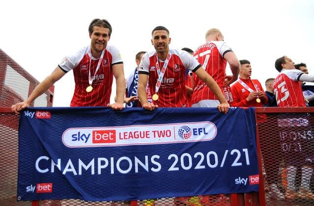 Mandatory Credit: Photo by Nizaam Jones JMP Shutterstock (11894506bm) Charlie Raglan and Liam Sercombe of Cheltenham Town celebrate after winning the league Cheltenham Town v Harrogate Town, UK - 08 May 2021 EDITORIAL USE ONLY No use with unauthorised audio, video, data, fixture lists (outside the EU), club league logos or live services. Online in-match use limited to 45 images (+15 in extra time). No use to emulate moving images. No use in betting, games or single club league player publications services. Cheltenham Town v Harrogate Town, UK - 08 May 2021 EDITORIAL USE ONLY No use with unauthorised audio, video, data, fixture lists (outside the EU), club league logos or live services. Online in-match use limited to 45 images (+15 in extra time). No use to emulate moving images. No use in betting, games or Copyright: xNizaamxJones JMP Shutterstockx 11894506bm