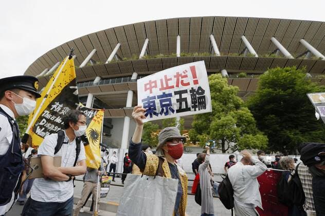 Protest against Tokyo Olympics People protest against holding the Tokyo Olympics amid the coronavirus pandemic, near National Stadium in Tokyo on May 9, 2021, as an Olympic test event for athletics is held inside the venue. 