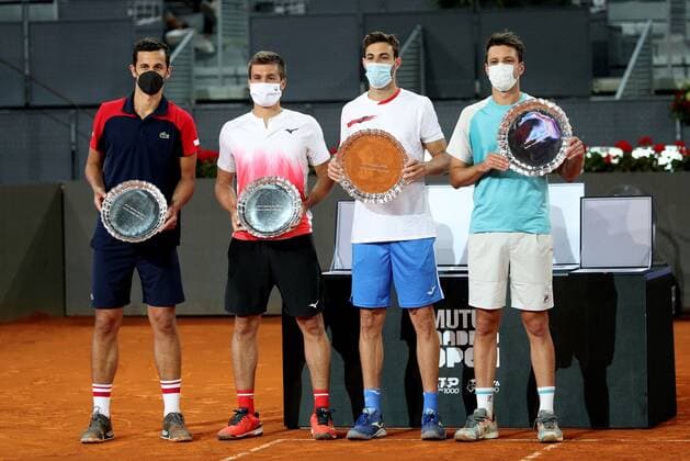 Marcel Granollers of Spain (2-R) and Horacio Zeballos (R) of Argentina pose with their trophies after winning the men s double final against Mate Pavic (L) and Nikola Mektic (2-L) of Croatia at the Mutua Madrid Open tennis tou?rnament in Madrid, Spain, 09 May 2021. Mutua Madrid Open tennis tou?rnament !ACHTUNG: NUR REDAKTIONELLE NUTZUNG!  Copyright: xRodrigoxJimenezx GRAF3345 20210509-637561774415546870