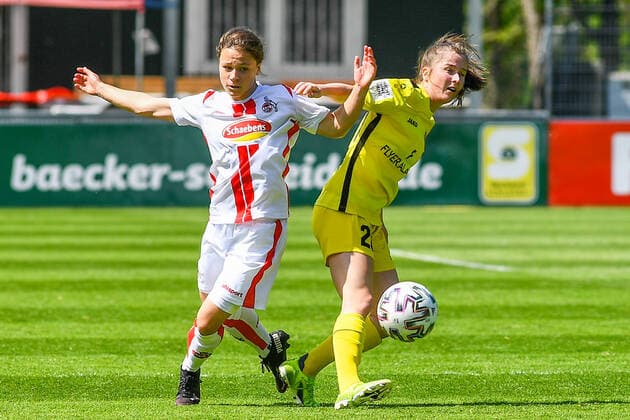 v.li.: Alicia-Sophie Gudorf (Köln, 12), Nicole Kreußer (Würzburger Kickers, 20), Zweikampf, Duell, duel, tackle, tackling, Dynamik, Action, Aktion, 09.05.2021, Köln (Deutschland), Fussball, 2. Frauen-Bundesliga Süd, 1. FC Köln - FC Würzburger Kickers, DFB DFL REGULATIONS PROHIBIT ANY USE OF PHOTOGRAPHS AS IMAGE SEQUENCES AND OR QUASI-VIDEO.